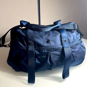 Lululemon blue tote with yoga straps and plenty of zippers and pockets!!!